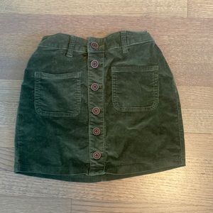 Kids green corduroy skirt with brown buttons
